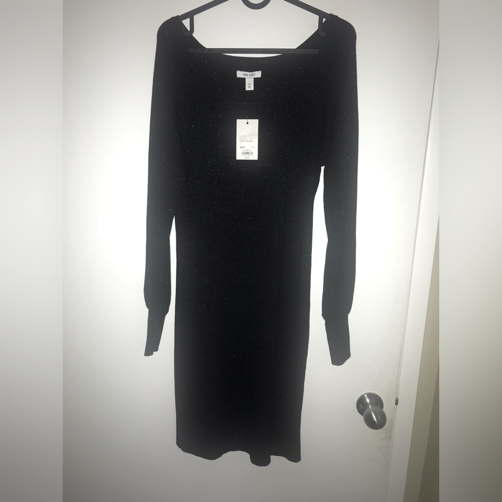 It’s a long sleeve sweater dress from Nine West brand new never warn size medium